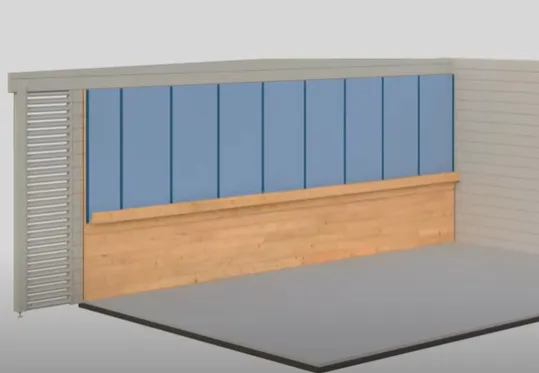 Longe meuble bleu avec compartiments et plan de travail en bois devant un mur de roulotte.
